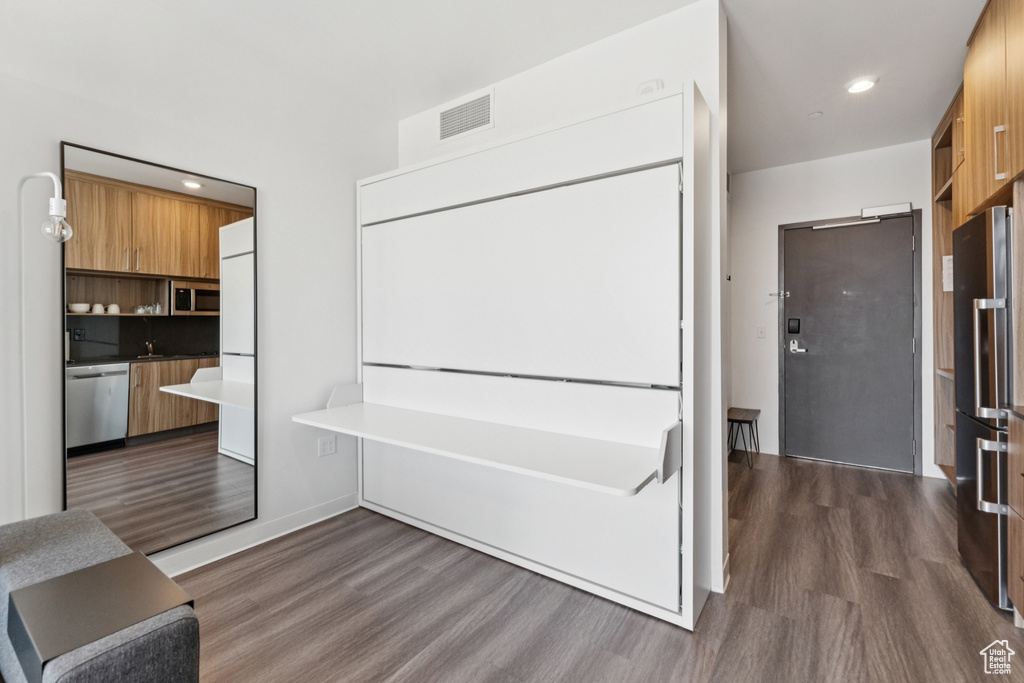 Interior space featuring wood finished floors and recessed lighting