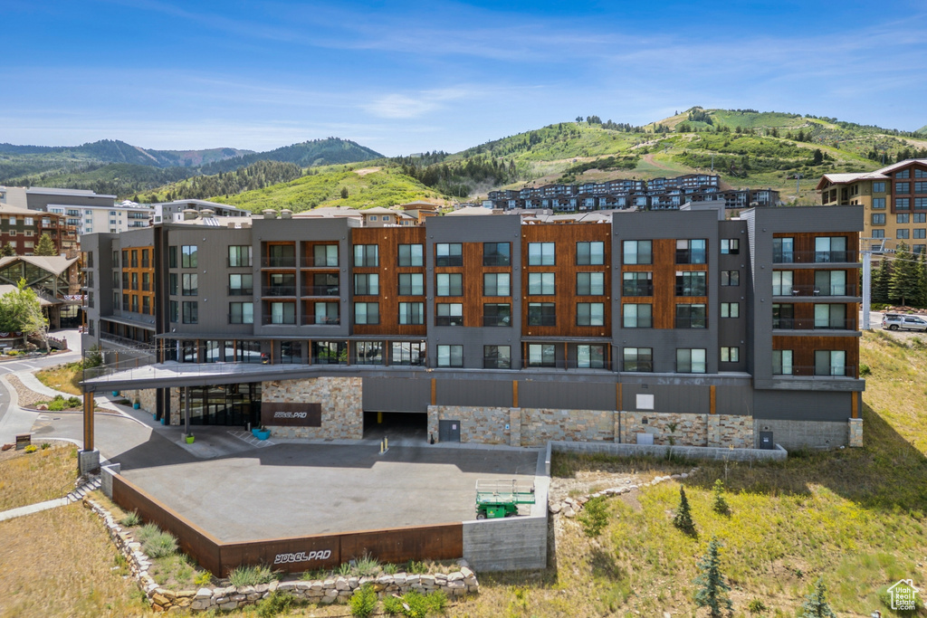 View of property with a mountain view