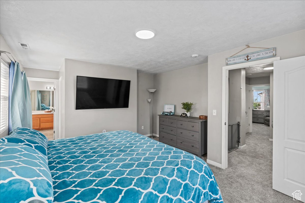 Bedroom with carpet flooring and baseboards