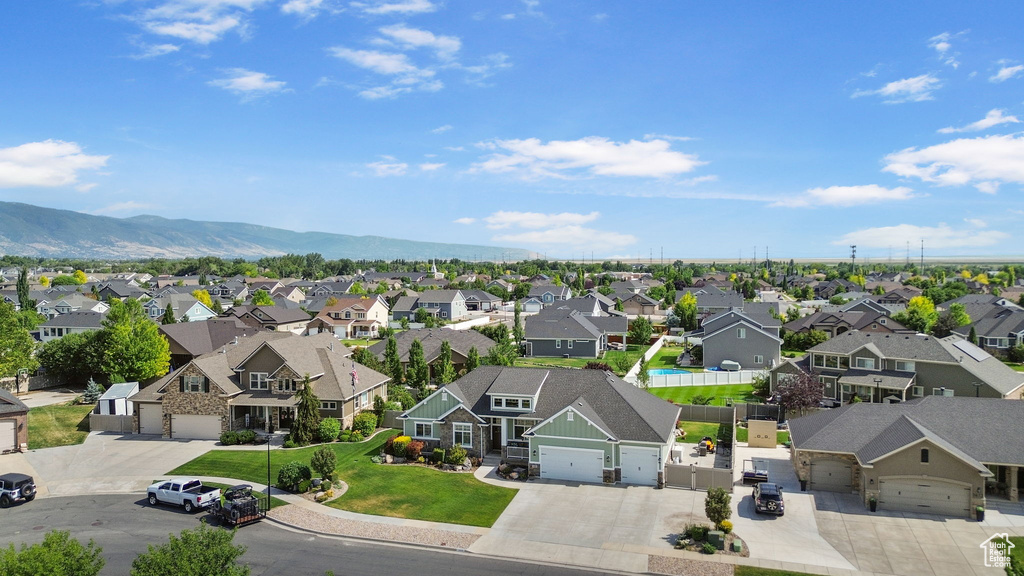 Aerial perspective of suburban area featuring a mountain backdrop