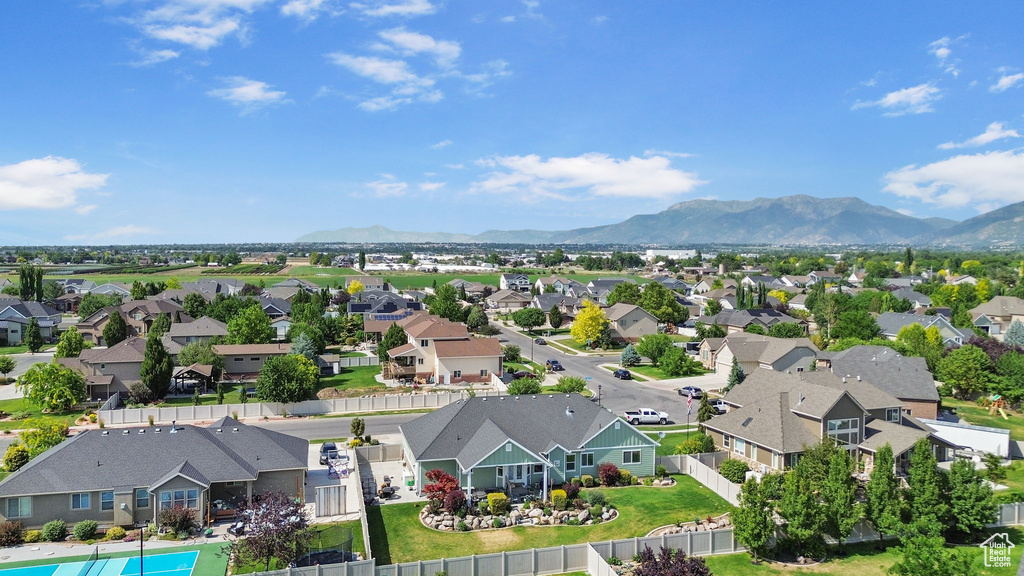 Aerial perspective of suburban area featuring a mountain backdrop