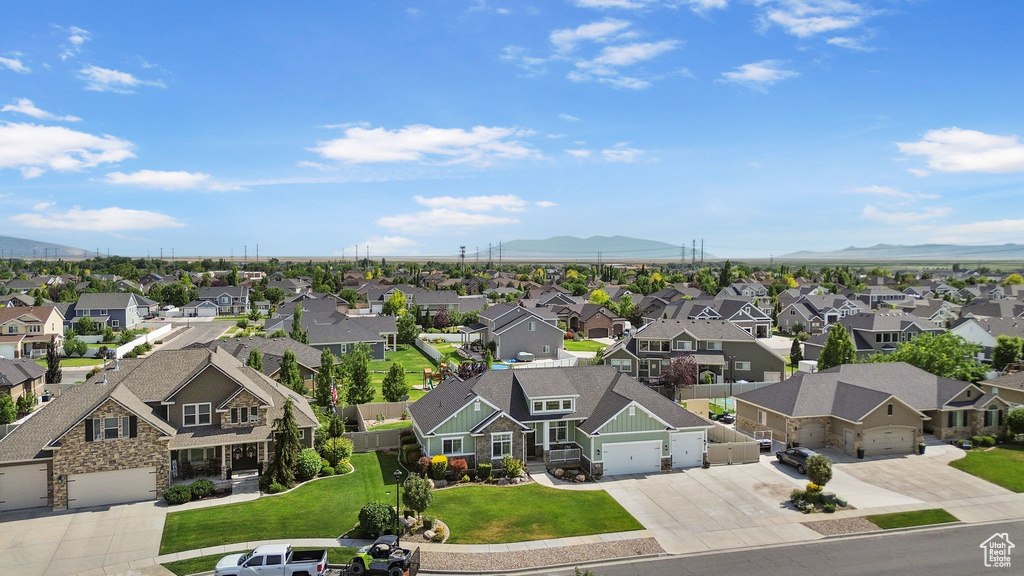 Aerial view of residential area featuring mountains