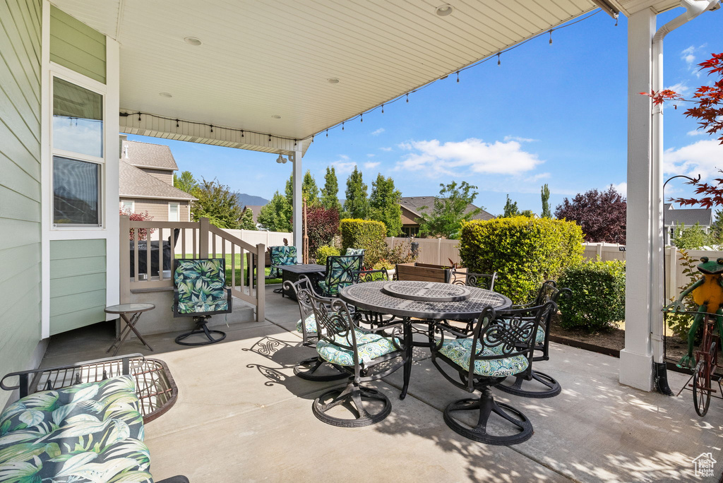 Fenced backyard featuring outdoor dining area and a patio area