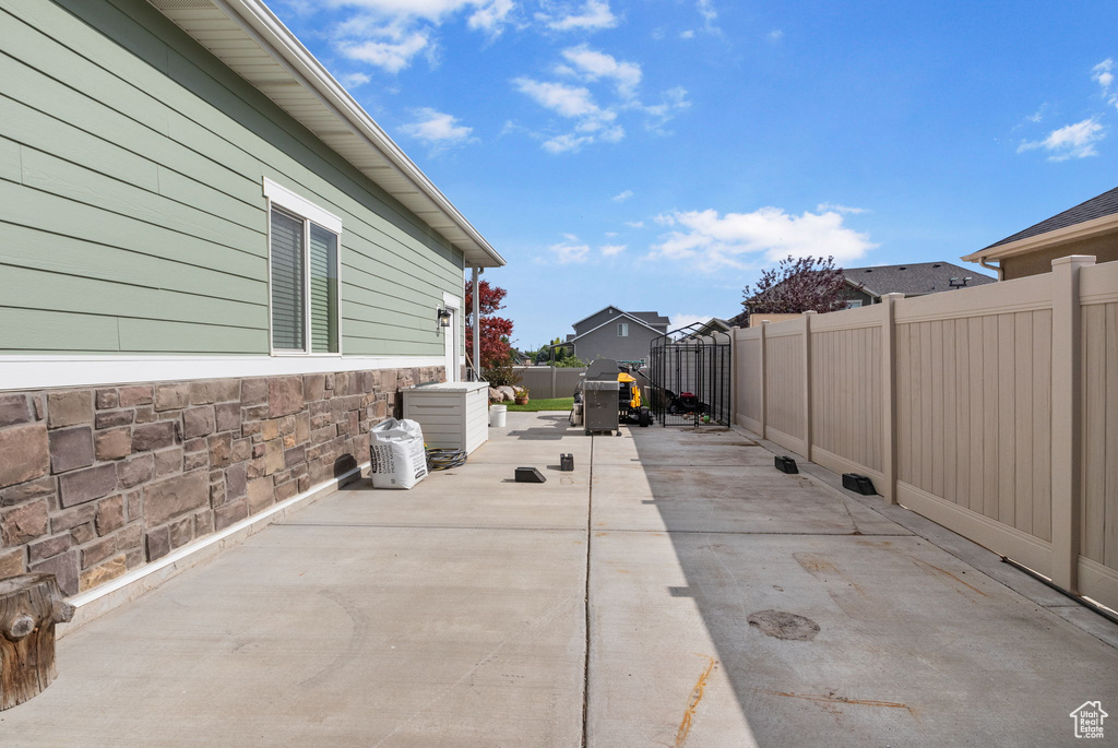 Fenced backyard featuring a patio