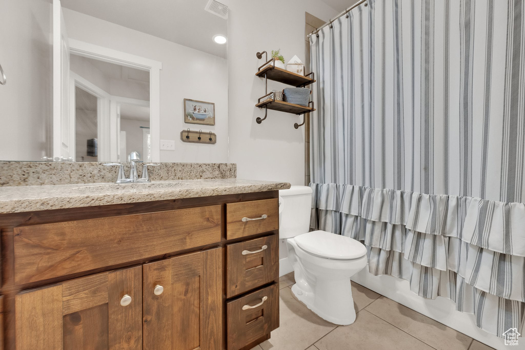Full bathroom featuring vanity and tile patterned floors