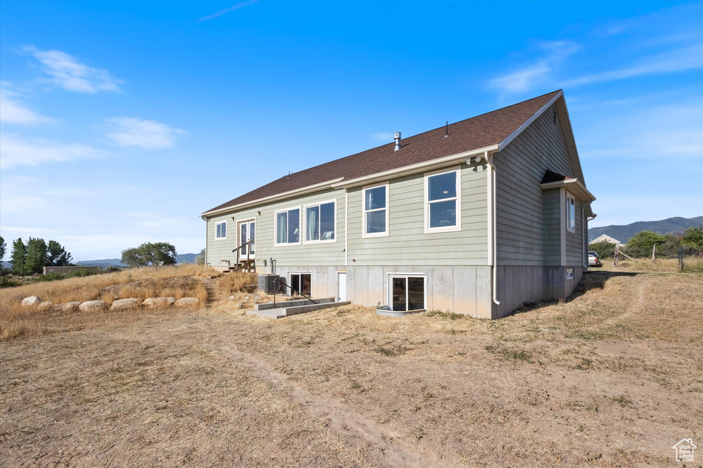 Rear view of house with a mountain view