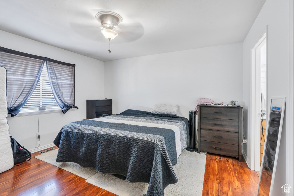Bedroom with wood finished floors and ceiling fan