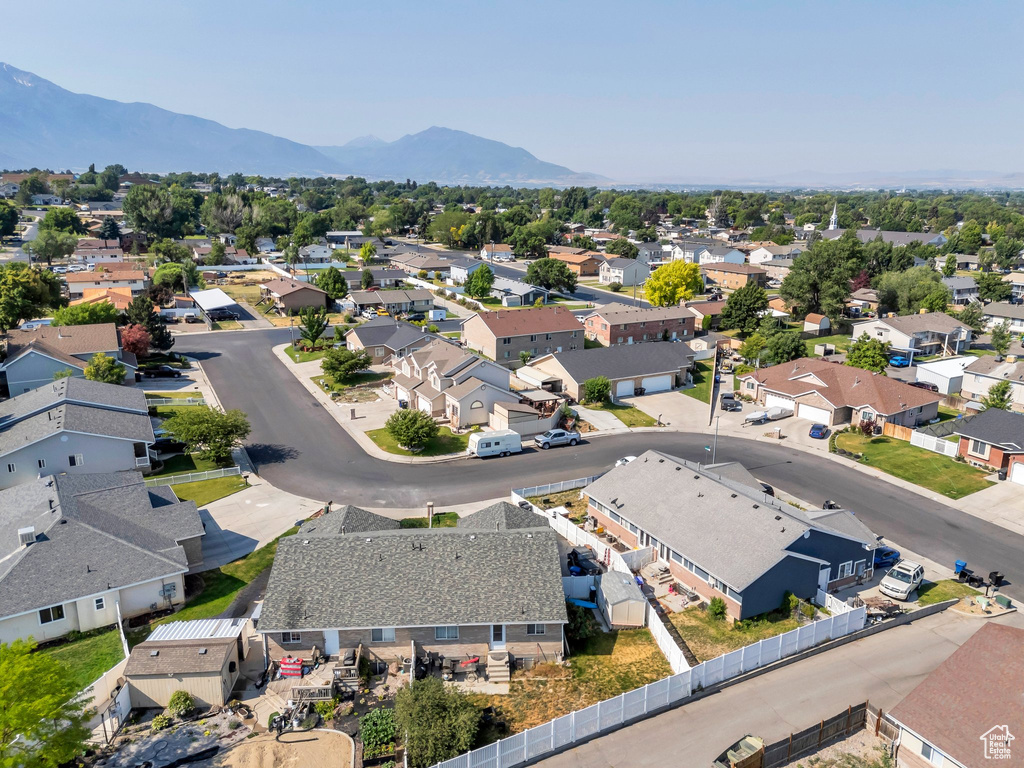 Aerial perspective of suburban area featuring a mountain backdrop