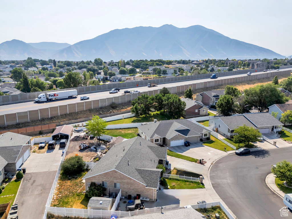 Aerial perspective of suburban area featuring a mountainous background