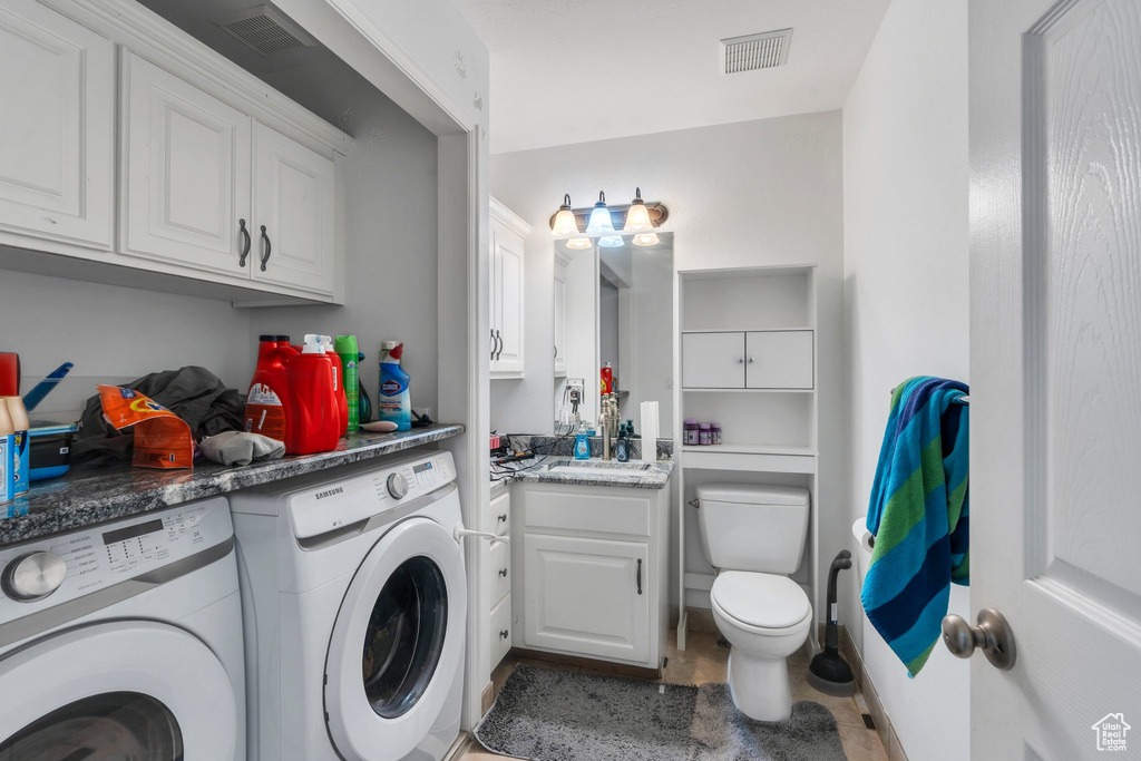 Laundry area featuring washing machine and clothes dryer