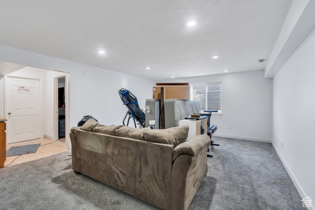 Living area featuring recessed lighting and light colored carpet