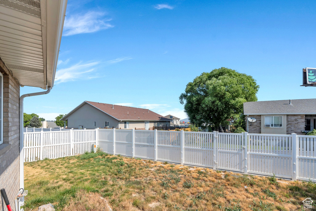 Fenced backyard with a residential view