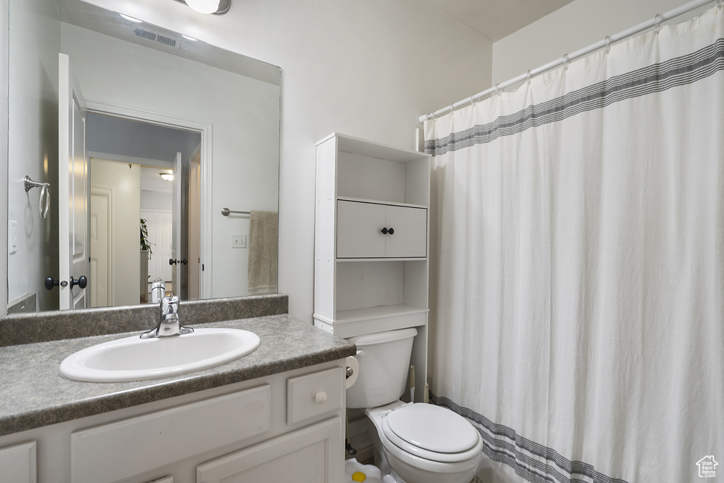 Bathroom featuring vanity and a shower with curtain