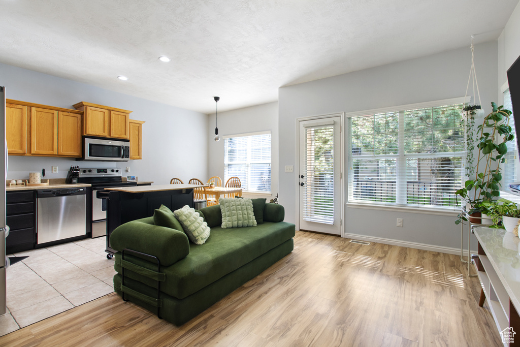 Living room featuring recessed lighting and light wood-style floors