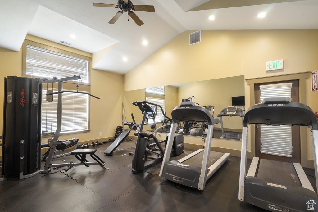 Workout area featuring a ceiling fan, recessed lighting, and high vaulted ceiling