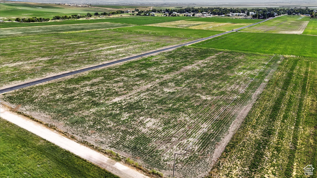 Aerial view of sparsely populated area with large plots for crops