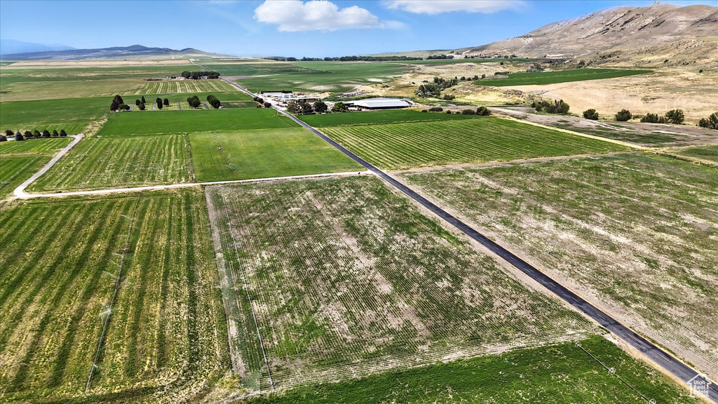 Aerial view of property and surrounding area with rural landscape and large plots for crops