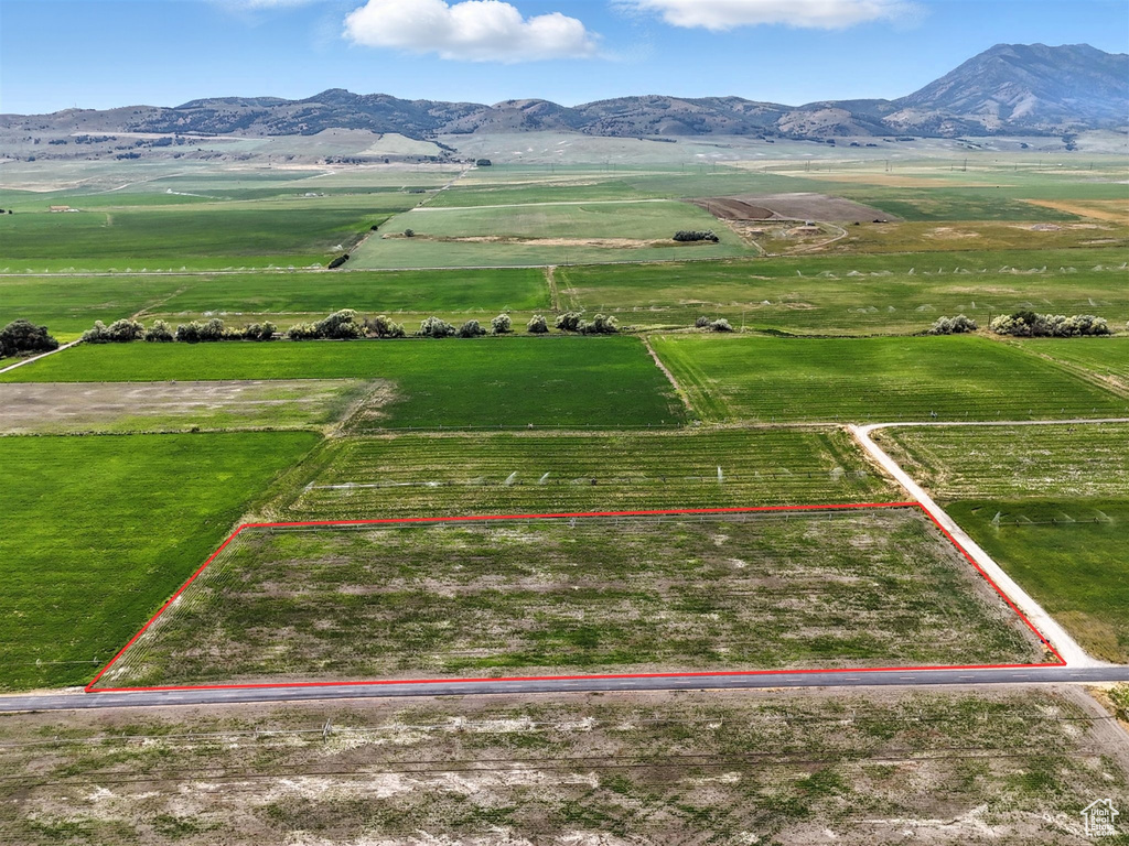 Overview of rural landscape with mountains, property boundaries highlighted, and abundant farmland