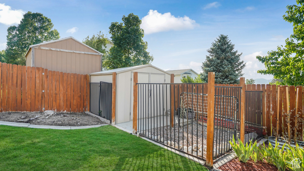 View of shed with a fenced backyard