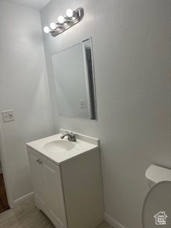 Bathroom with toilet and vanity