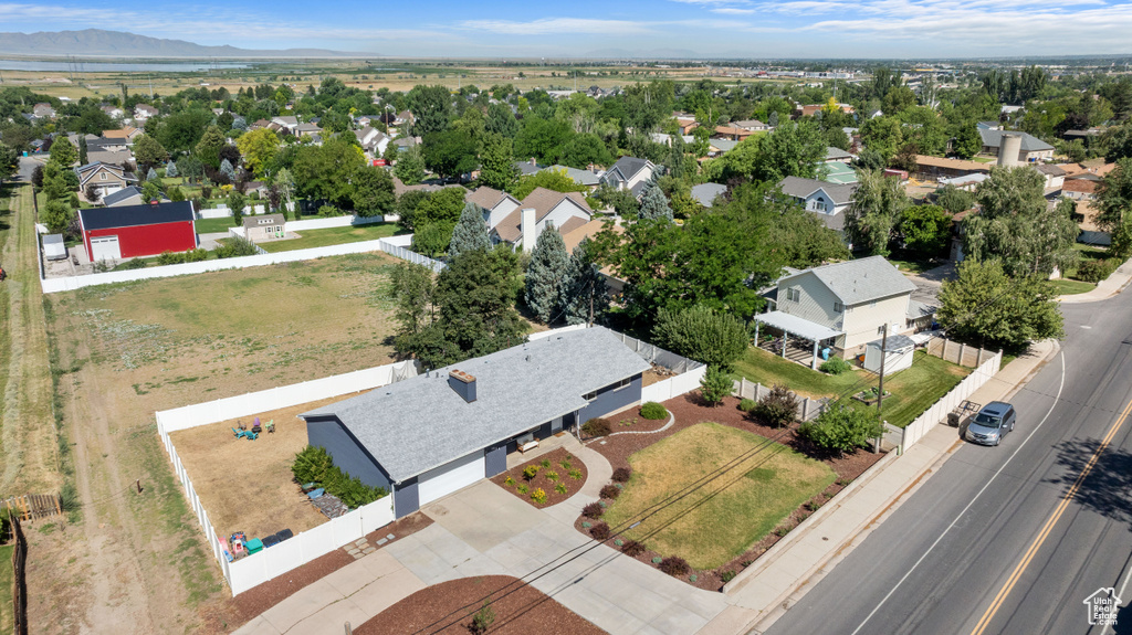 Aerial view of residential area featuring a mountain backdrop