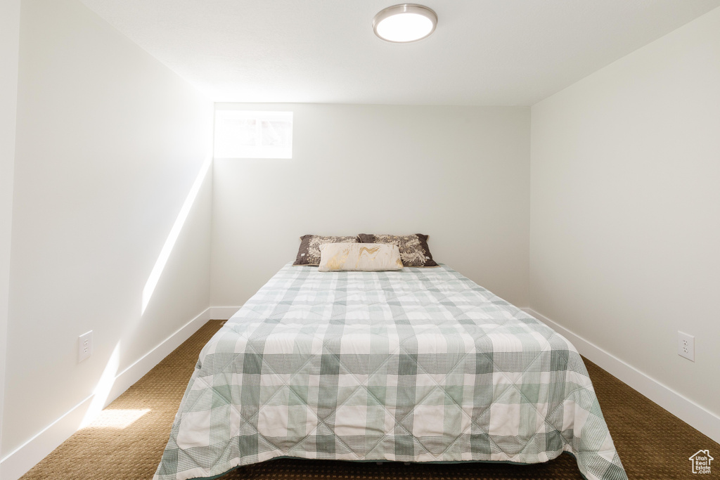 Bedroom with dark carpet