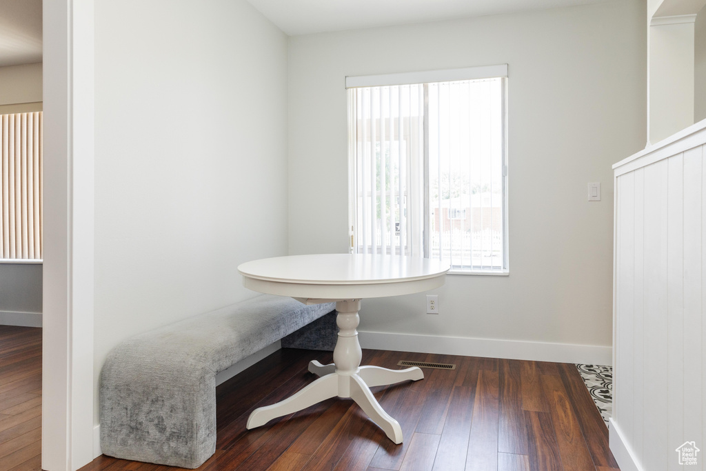 Dining space featuring plenty of natural light and wood finished floors
