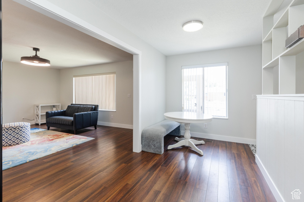 Home office featuring dark wood finished floors