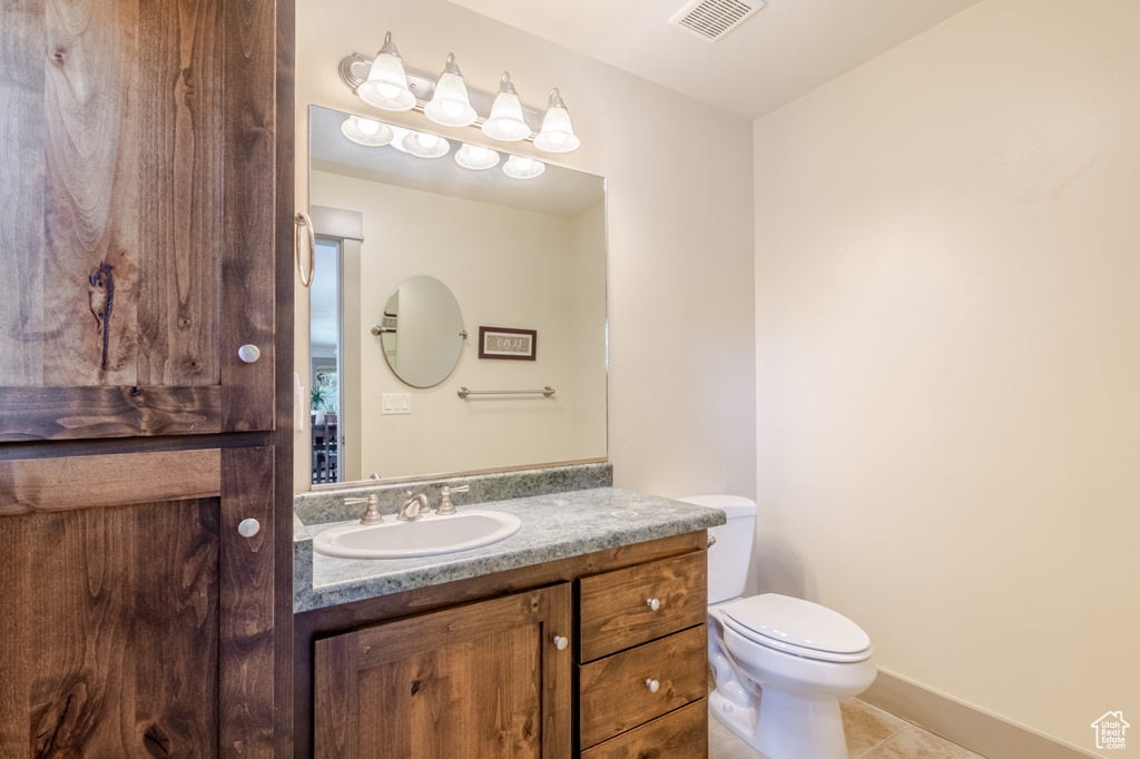 Bathroom with vanity and tile patterned floors