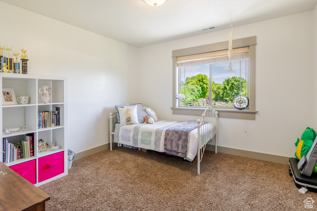Bedroom featuring carpet