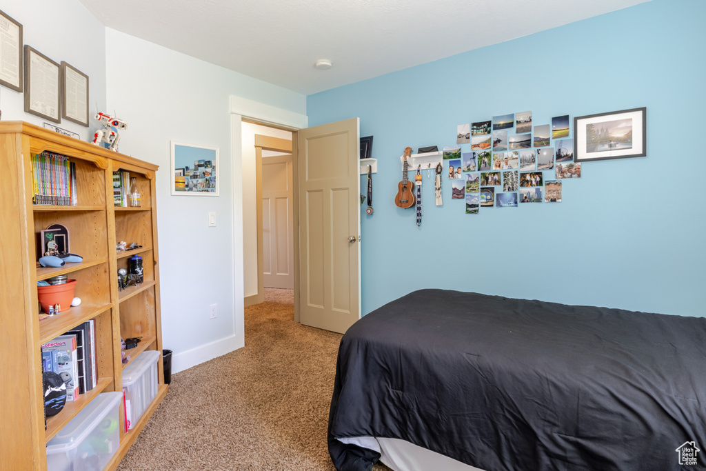 Bedroom with carpet and baseboards