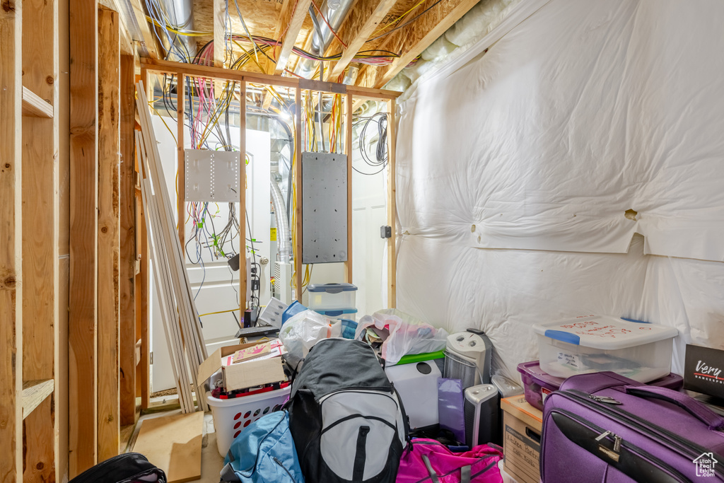 Unfinished basement with electric panel