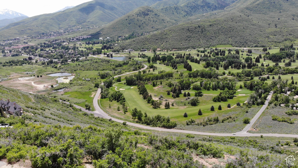 View of property location with a water and mountain view