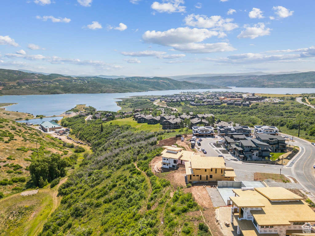 Aerial perspective of suburban area featuring a water and mountain view