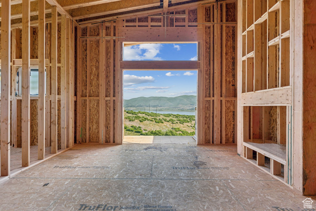 Miscellaneous room featuring a water and mountain view