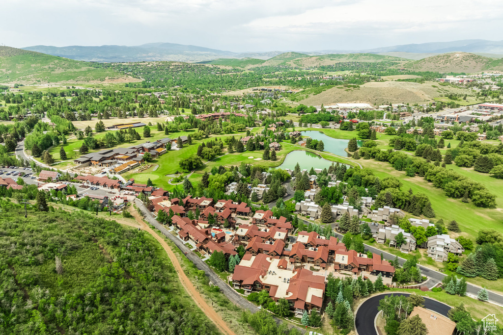 Aerial perspective of suburban area with a water and mountain view