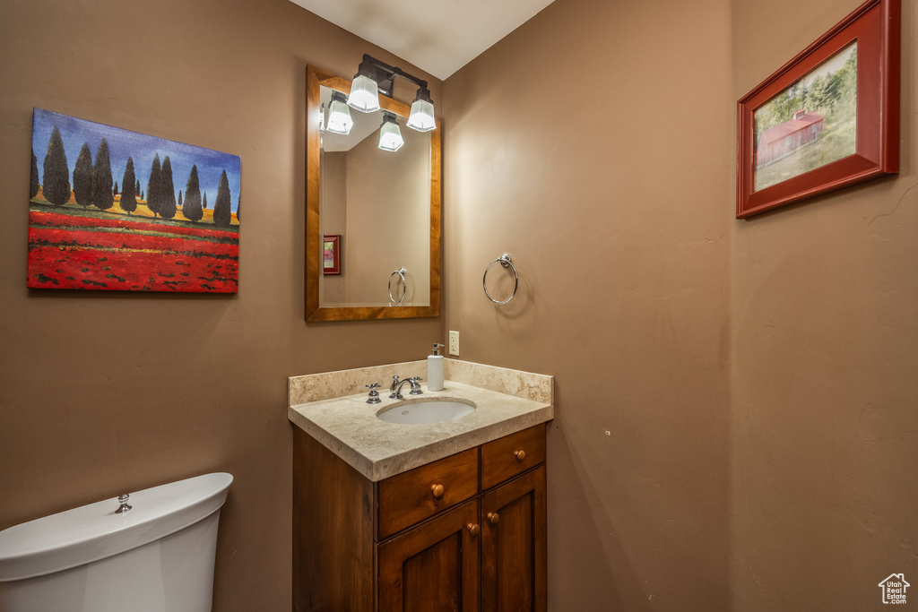 Bathroom with toilet and vanity