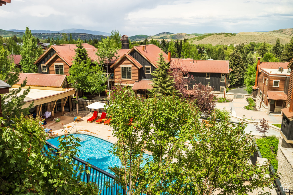 View of swimming pool featuring a mountain view and a patio area