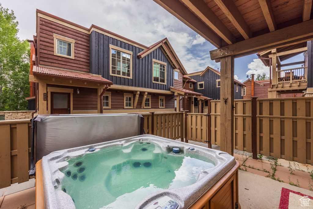 View of patio / terrace featuring a hot tub