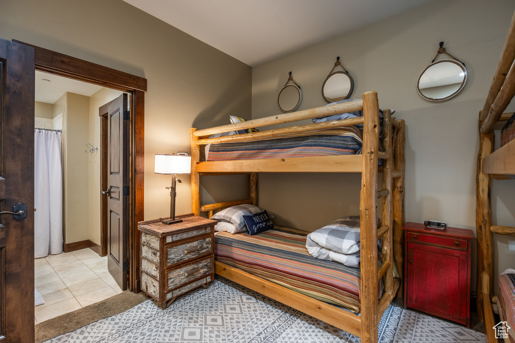 Bedroom with light tile patterned floors