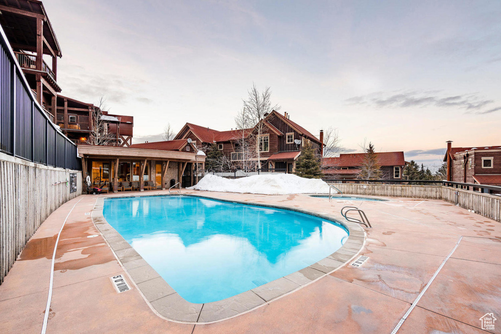 Community pool featuring a patio