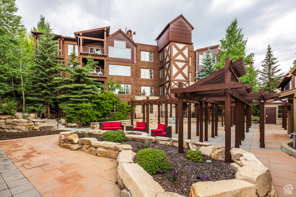 View of patio / terrace featuring a pergola and an outdoor living space
