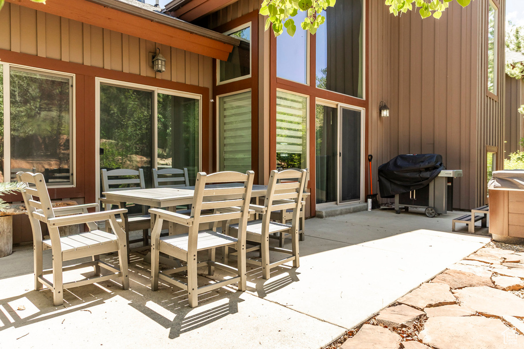 View of patio / terrace with outdoor dining space and a grill