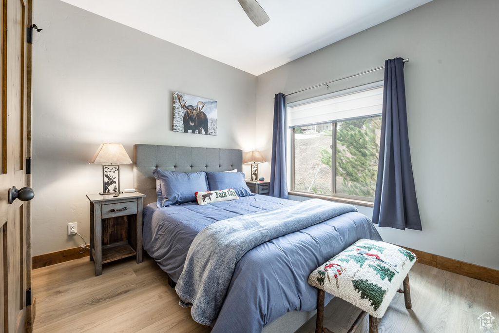 Bedroom featuring wood finished floors and ceiling fan