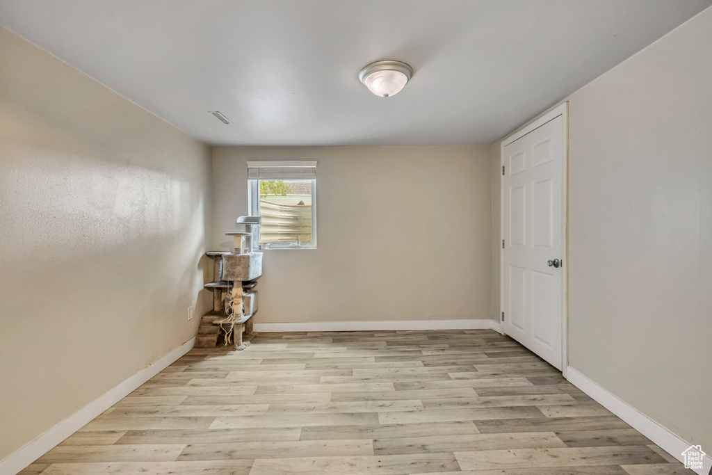 Empty room featuring light wood-style flooring