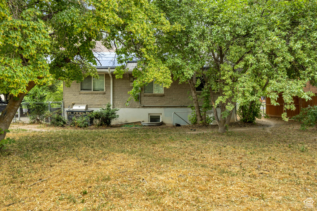 View of side of home featuring brick siding