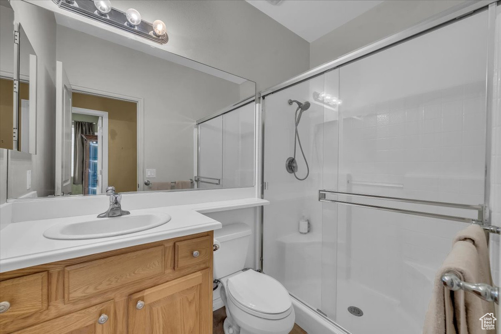 Bathroom with a stall shower and vanity