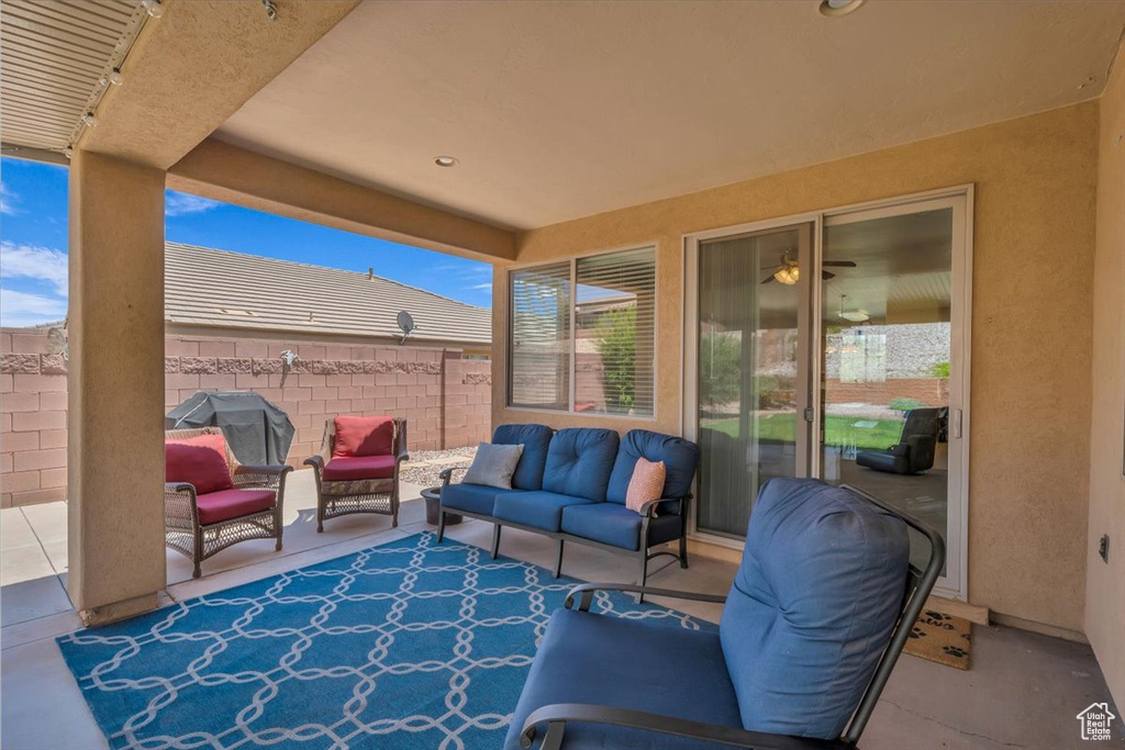 View of patio featuring an outdoor hangout area and grilling area