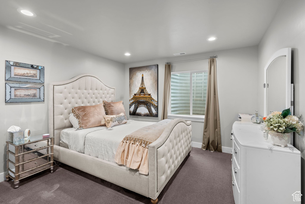 Bedroom featuring recessed lighting, dark colored carpet, and washer / dryer