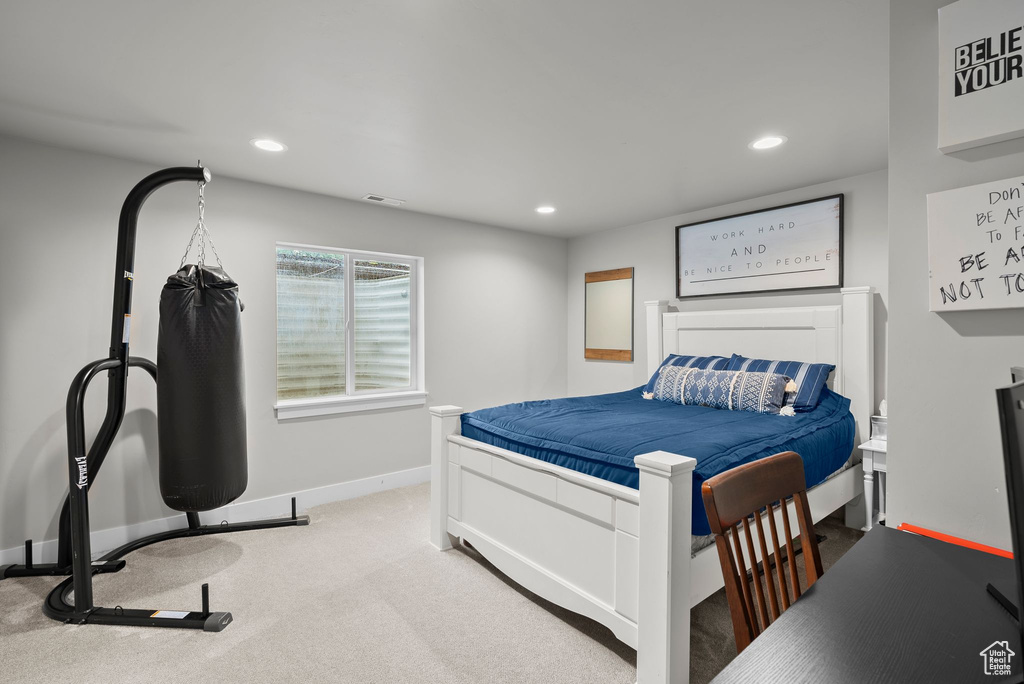 Carpeted bedroom featuring recessed lighting